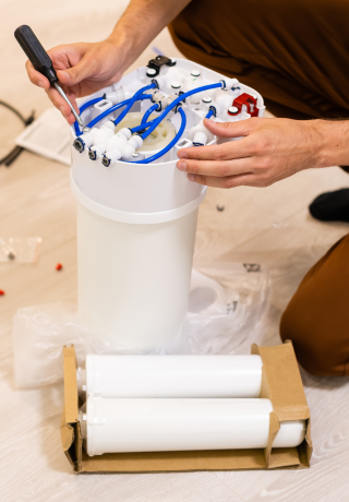 Technician servicing purifier